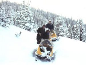 Snowmobiling on a snowy ridge